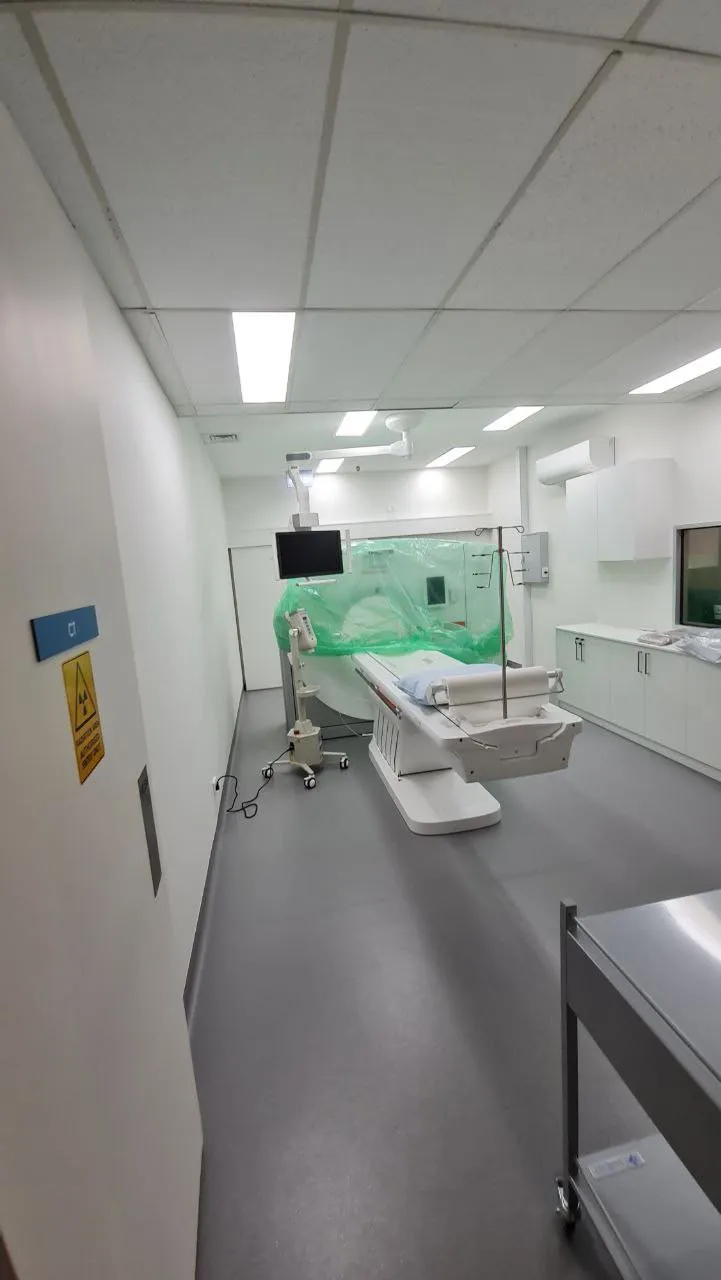 A clinic treatment room at the end of a corridor