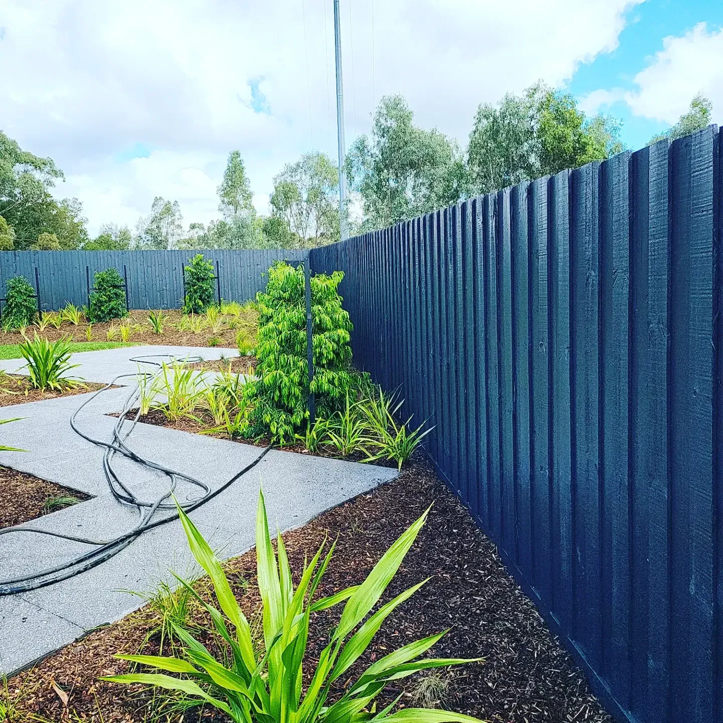 The same fence painted charcoal