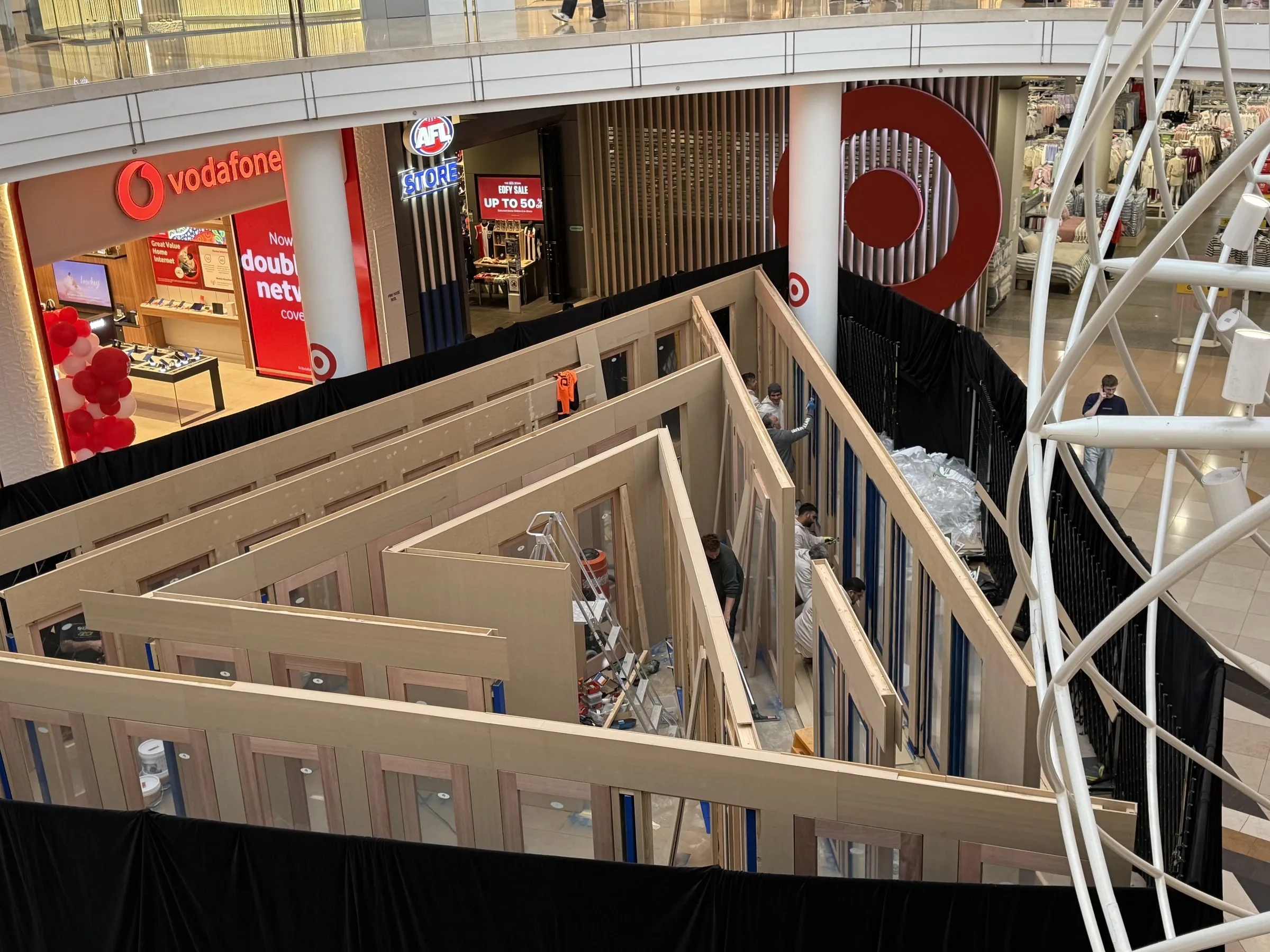 A shopping mall unit in bare wood framing