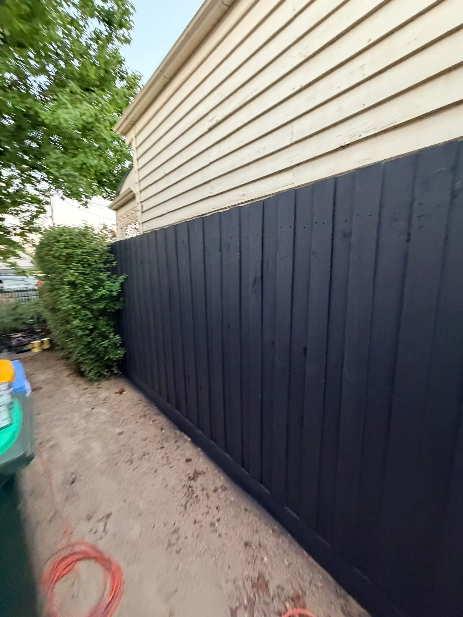 A side wall of lap siding painted near-black
